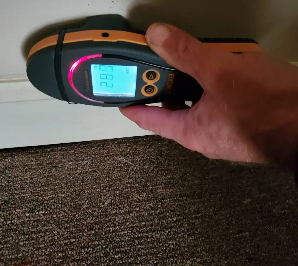 Moisture detection at baseboard during Burst Pipe Cleanup in Cannon
